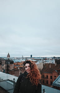 woman wearing black dress standing near the house thumbnail