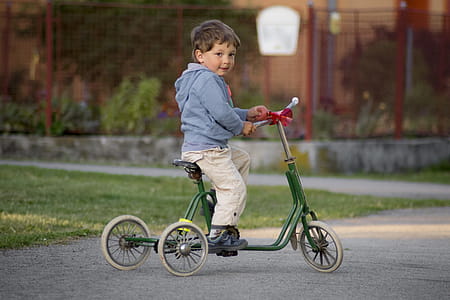 Boy Riding Green bike thumbnail