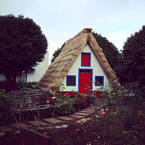 Brown, White, and Red House Near Garden at Daytime thumbnail