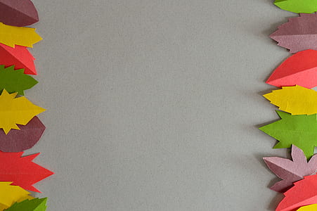 closeup photo of red, brown, and green leaf paper artwork thumbnail