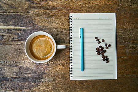 white ceramic mug on top of brown wooden surface thumbnail