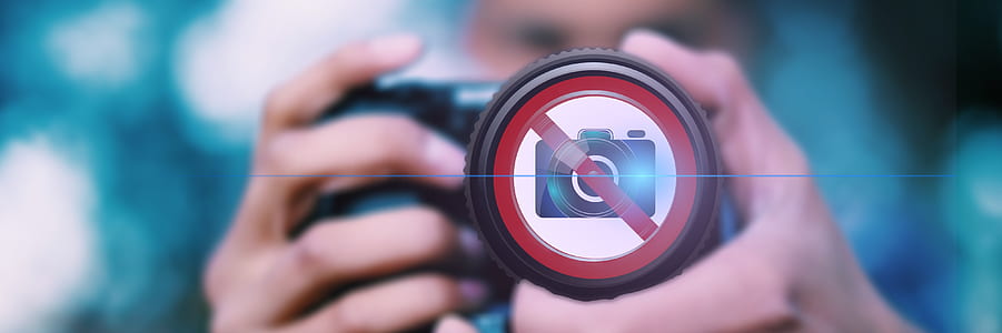 selective focus photography of person using camera thumbnail