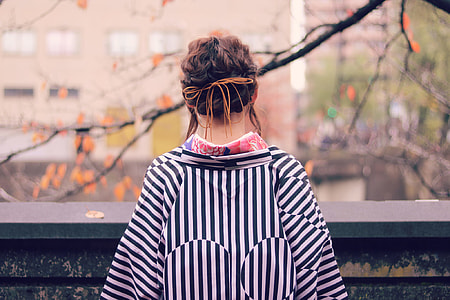 woman wearing black-and-white downstriped top thumbnail