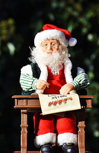Santa Claus doll sitting on desk thumbnail