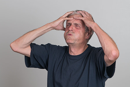 man touching his head thumbnail
