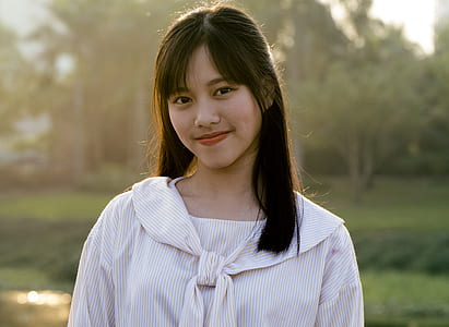woman wearing white pinstripe top thumbnail