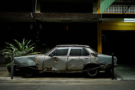 classic gray sedan near budiling thumbnail