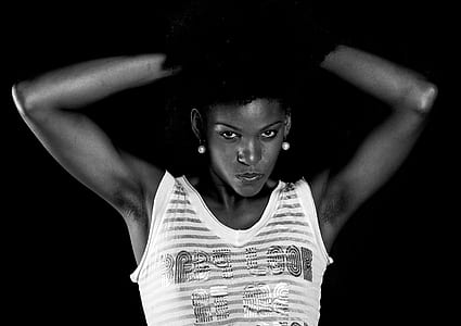 woman wearing tank top raising arms thumbnail