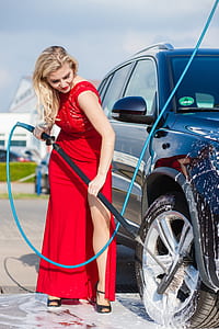 woman wearing gown washing vehicle thumbnail