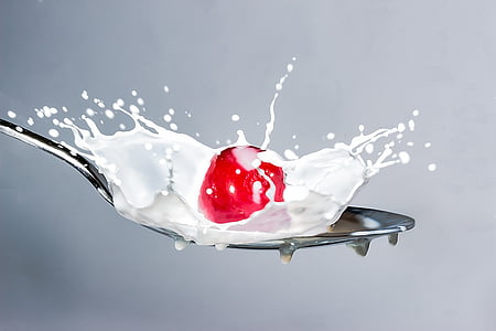 cherry and milk poured on spoon thumbnail