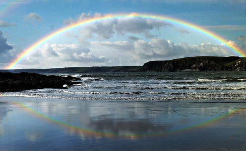 Rainbow and Rainbow Reflection over a large lake thumbnail