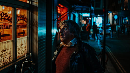 man standing in front of store thumbnail