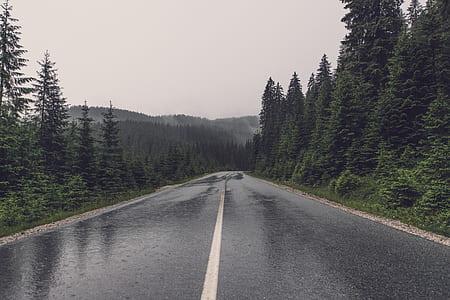 gray asphalt road under the cloudy sky thumbnail