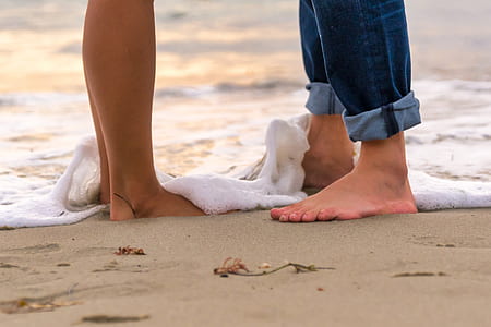 two person standing on the sand thumbnail