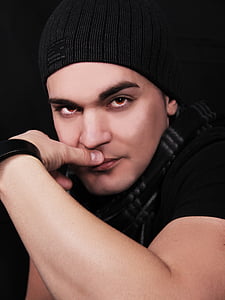 man wearing black shirt and knit cap thumbnail