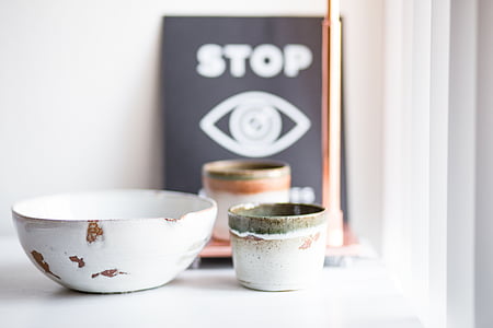 round white and brown ceramic bowl on white surface thumbnail
