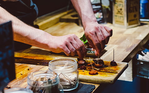 person preparing meat with stick thumbnail