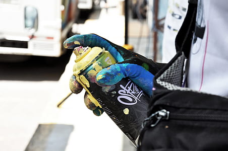 person holding black spray can thumbnail
