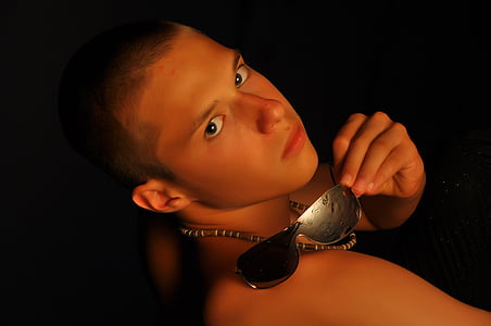 man holding sunglasses thumbnail
