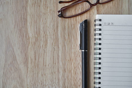 notebook beside a pen and eyeglasses wallpaper thumbnail