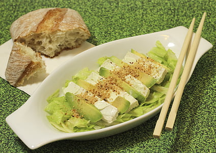 sliced fruit with vegetable leaf and chopsticks on bowl thumbnail