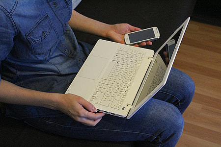 person using white laptop thumbnail