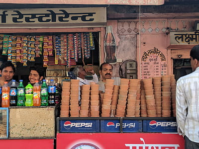 Person Selling Brown Clay Pots thumbnail