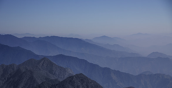 aerial view of mountains covered with fogs thumbnail