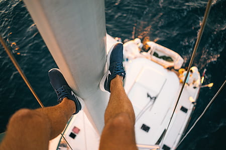 person in blue Nike low-top sneakers thumbnail