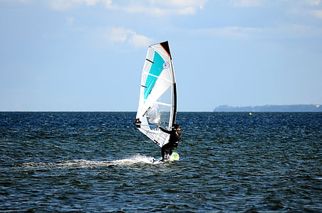 man riding sail boat during daytime thumbnail