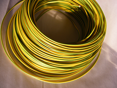 close-up photo of yellow cable on brown surface thumbnail