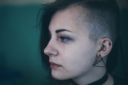 shallow focus photography of woman wearing black earring facing on her right side thumbnail