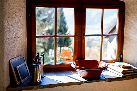 close-up photo of brown bowl infront of windowpane thumbnail