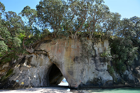 landscape photography of cave rock formation thumbnail
