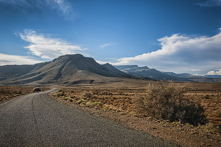 gray ground and mountain at daytime thumbnail