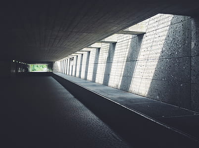 Sunlight Streaming Through Concrete Opening of Underground Passageway thumbnail