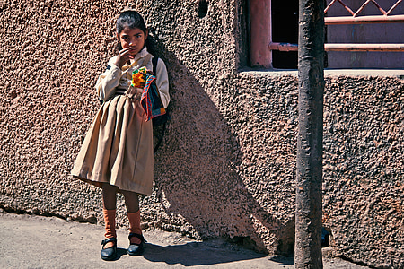 girl standing near concrete wall thumbnail