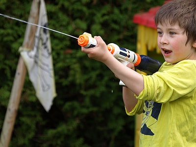 boy holding a white water gun thumbnail