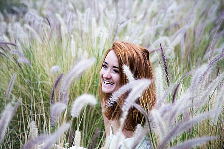 woman hiding in white flowers thumbnail