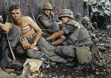 soldiers sitting on ground leaning on wall thumbnail