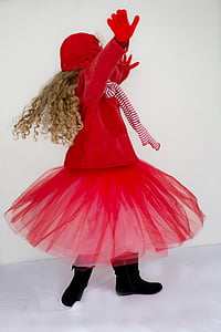 girl wearing red coat and tutu skirt thumbnail