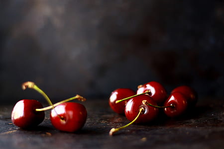 six cherries on brown surface thumbnail