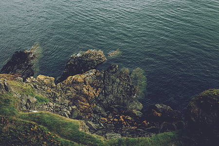 high-angle view of cliff near body of water thumbnail