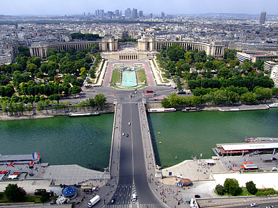 birds eye photography of bridge between buildings and tress thumbnail