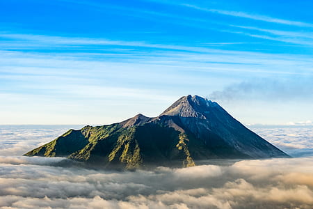 mountain peak surrounded by clouds thumbnail