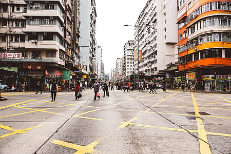 group of people standing on road near building thumbnail