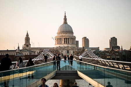 people walking on glass near concrete dome building thumbnail