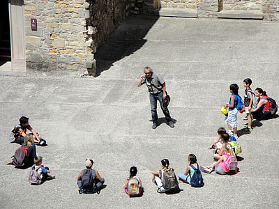 people on street sitting and standing during daytime thumbnail