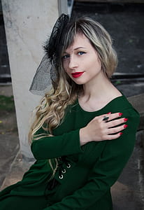 woman wearing green long-sleeved dress thumbnail