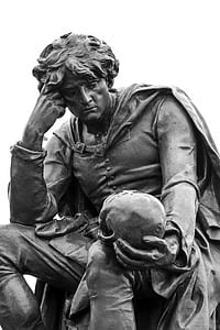 man holding skull statue thumbnail